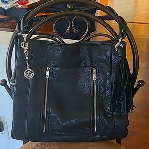 DKNY super soft leather bag, very roomie and 4 pockets on inside, 2 outside
